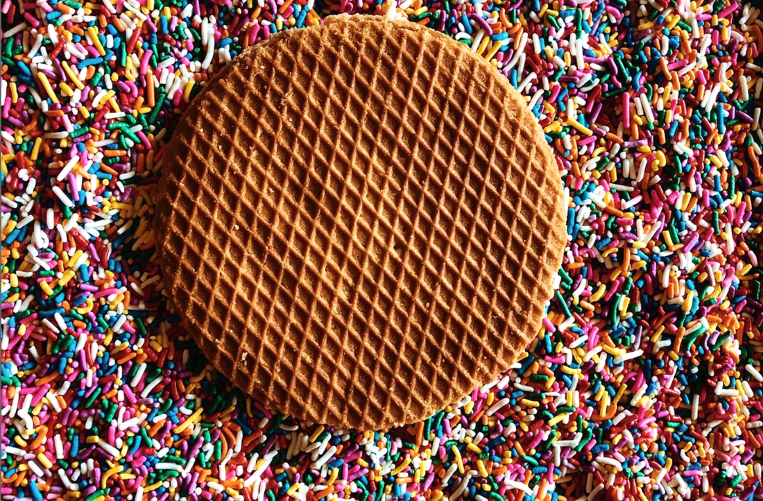 a gluten free, vegan, classic Stroopwafels laying in sprinkles  Fondue from Dutch Waffle Company LLC, DWC, Stroopwafels Fresh is Best!