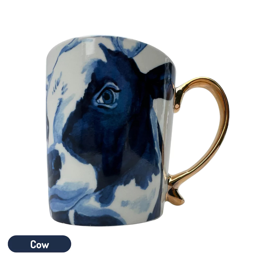 Dutch gold handle mug with cow design